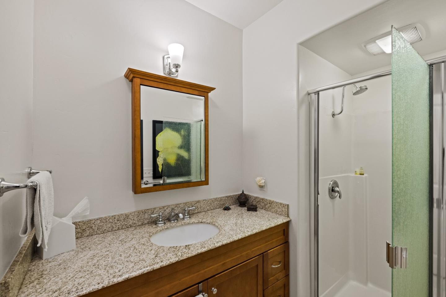 27 La Rancheria Carmel Valley, CA 93924 - Photo 21 of 30 a bathroom with a granite countertop sink shower and a mirror