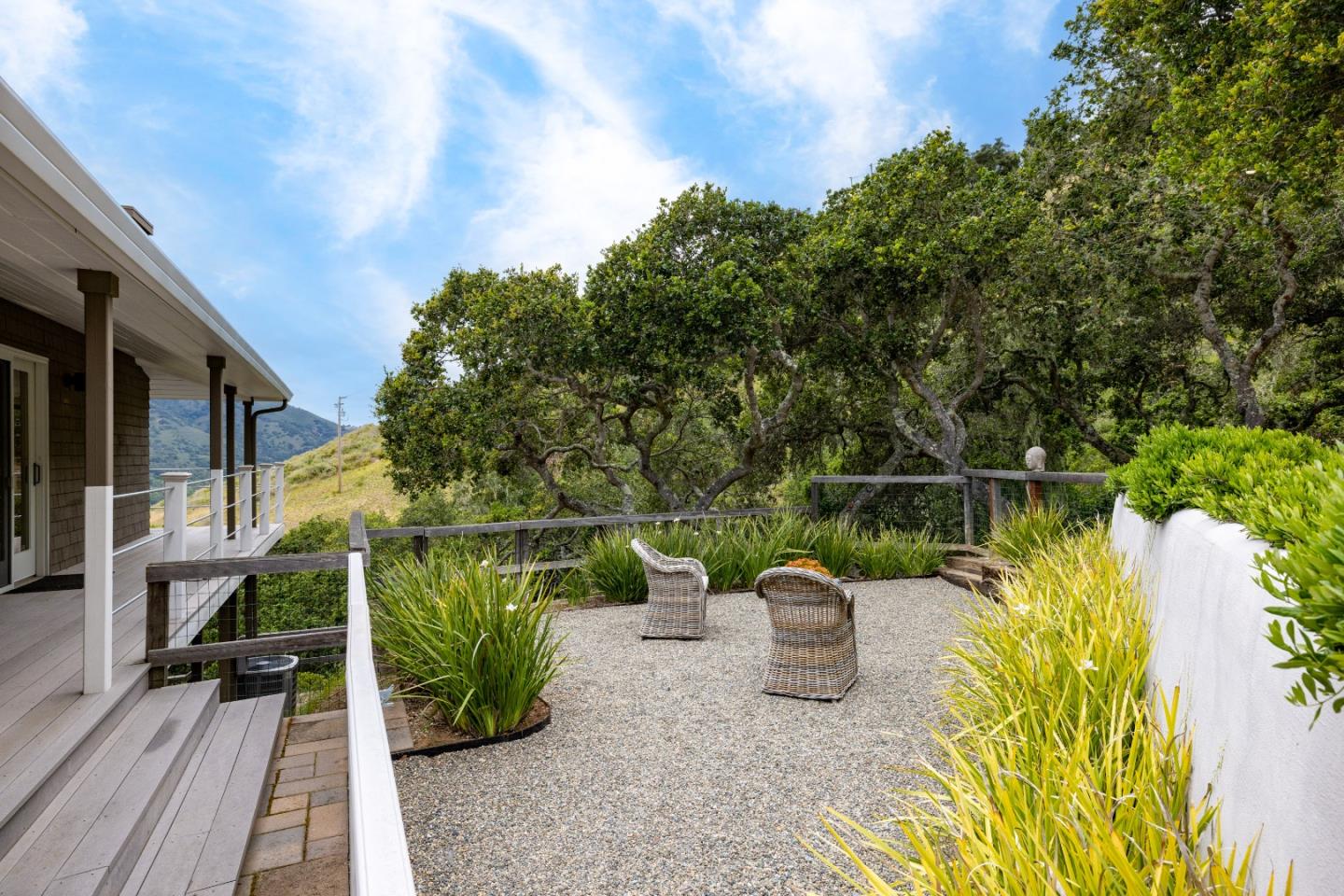 27 La Rancheria Carmel Valley, CA 93924 - Photo 27 of 30 a view of a balcony with two chairs and a potted plant