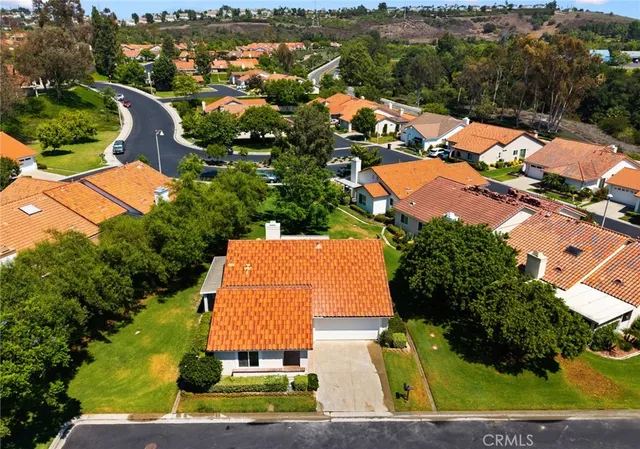 an aerial view of residential houses and outdoor space