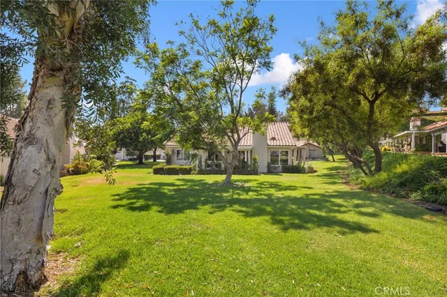 a view of a fountain in front of the house