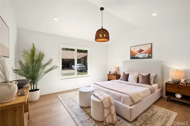 a bedroom with a large bed and a window