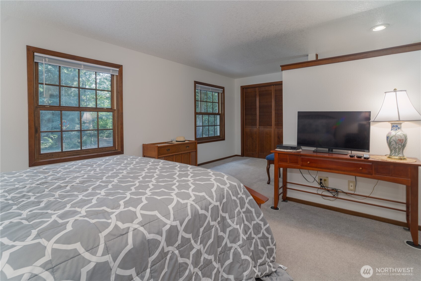 2102 Mark Street Northeast Olympia, WA 98516 - Photo 20 of 37 a bedroom with a bed and a flat screen tv