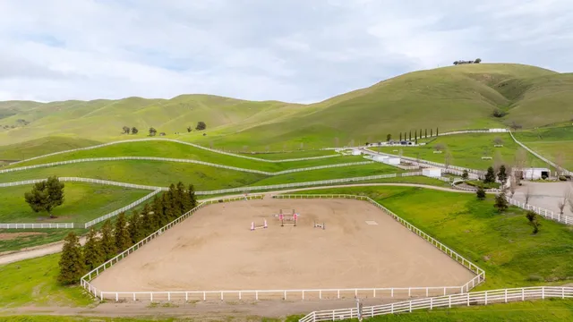 a view of a livingroom with workspace and a window