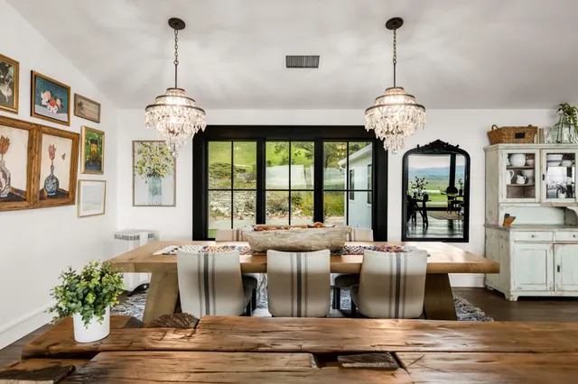 a kitchen with stainless steel appliances kitchen island granite countertop a refrigerator sink and cabinets