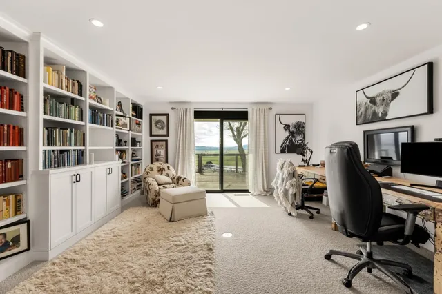 a view of swimming pool with chairs