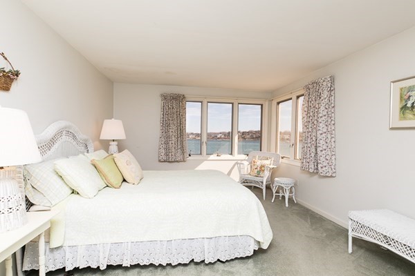 23 Wyoma Road Gloucester, MA 01930 - Photo 12 of 22 a bedroom with a bed and window