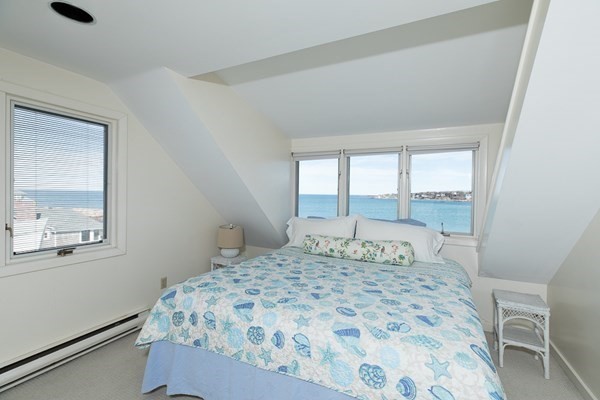 23 Wyoma Road Gloucester, MA 01930 - Photo 15 of 22 a bedroom with a large bed and a window