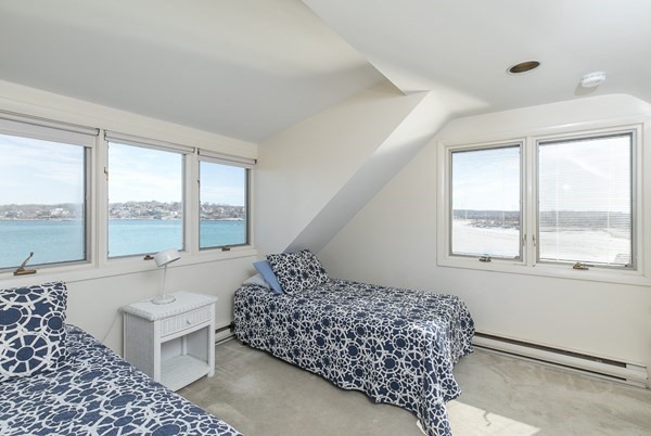 23 Wyoma Road Gloucester, MA 01930 - Photo 16 of 22 a bedroom with a bed and a large window