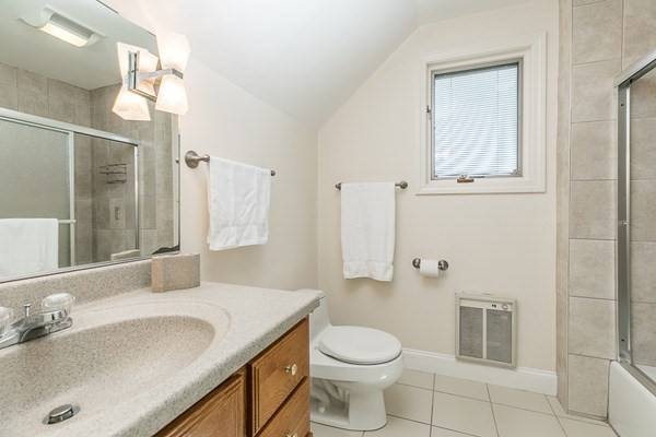 23 Wyoma Road Gloucester, MA 01930 - Photo 17 of 22 a bathroom with a granite countertop sink toilet and shower