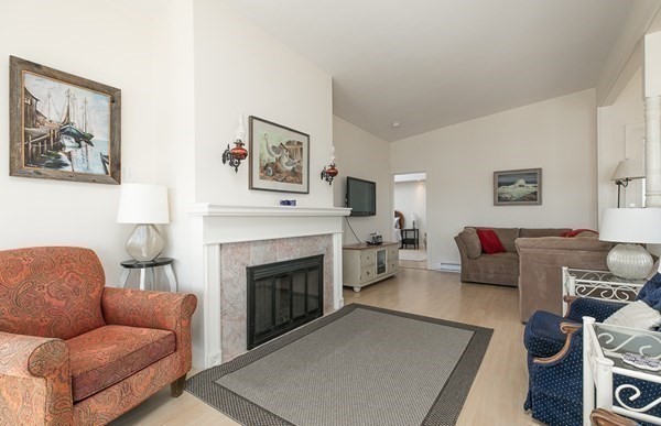 23 Wyoma Road Gloucester, MA 01930 - Photo 3 of 22 a living room with furniture and a fireplace