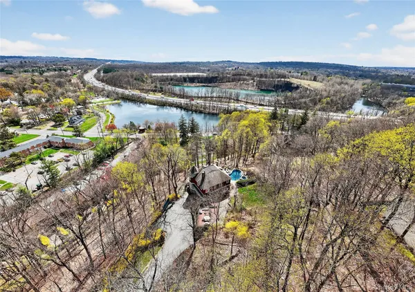 a backyard of a house with outdoor seating