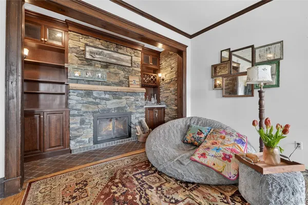 a living room with furniture and a fireplace