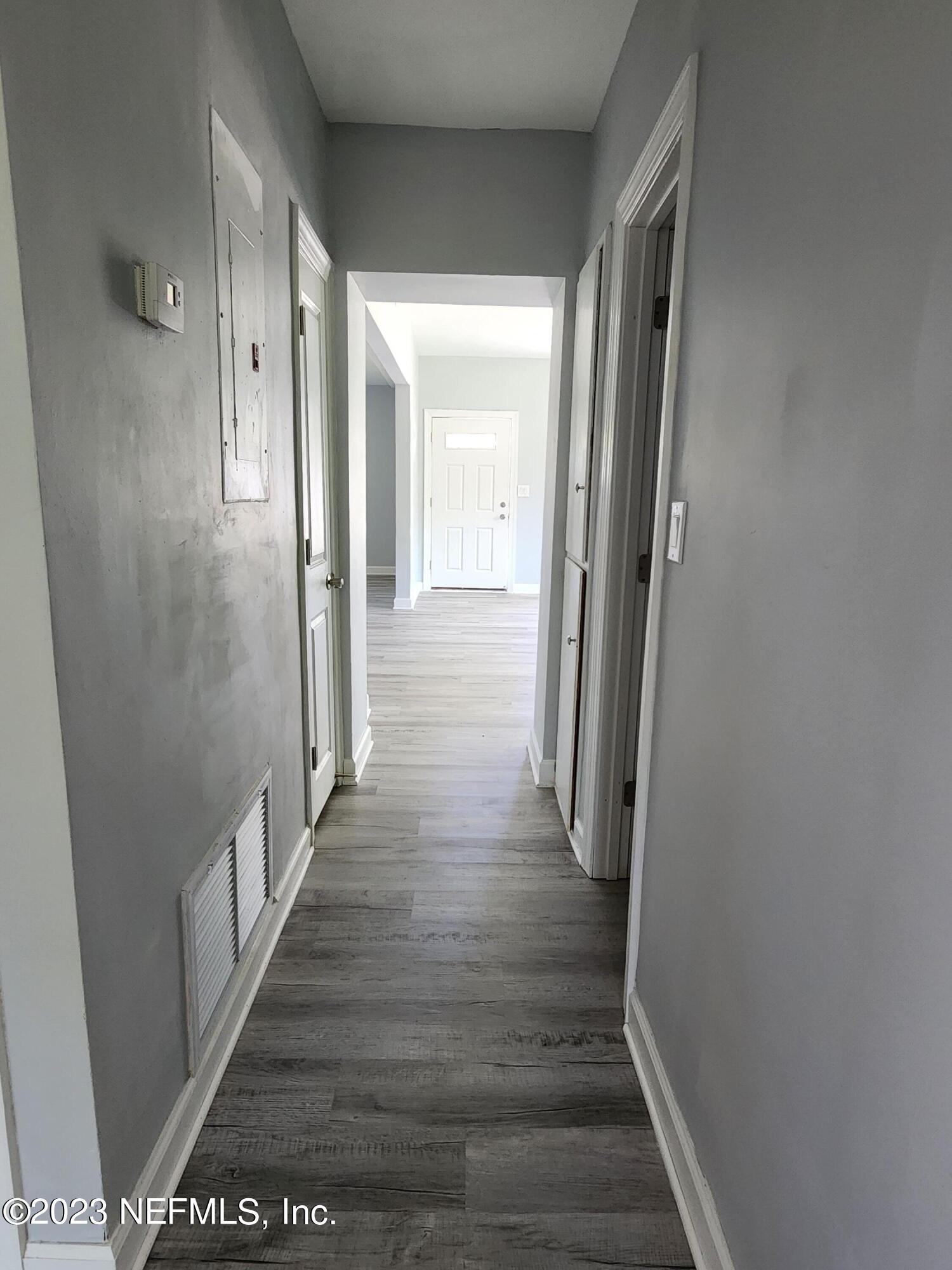 1306 Morgana Road Jacksonville, FL 32211 - Photo 20 of 33 a view of a hallway with wooden floor