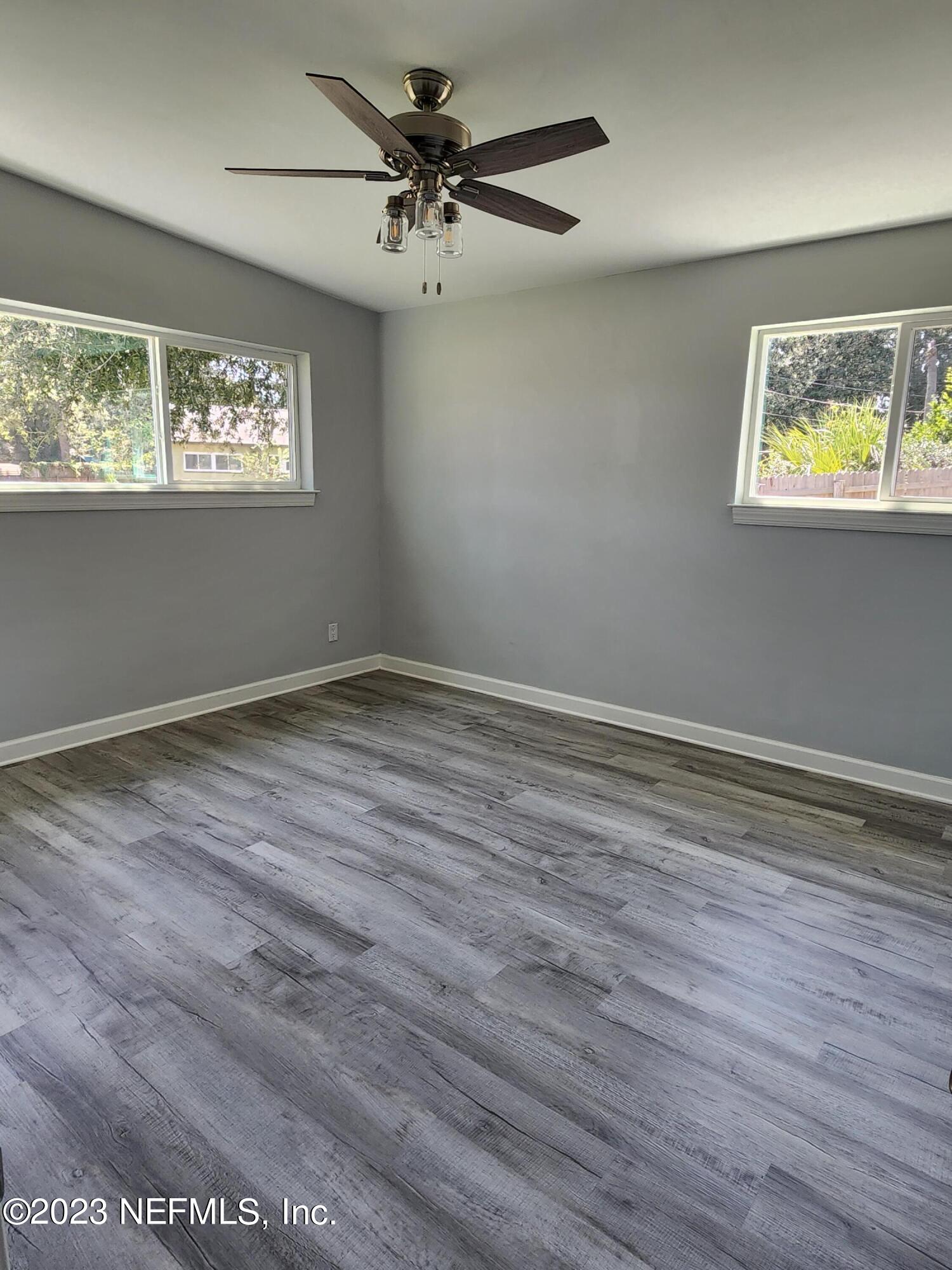 1306 Morgana Road Jacksonville, FL 32211 - Photo 24 of 33 a view of an empty room with a window and wooden floor
