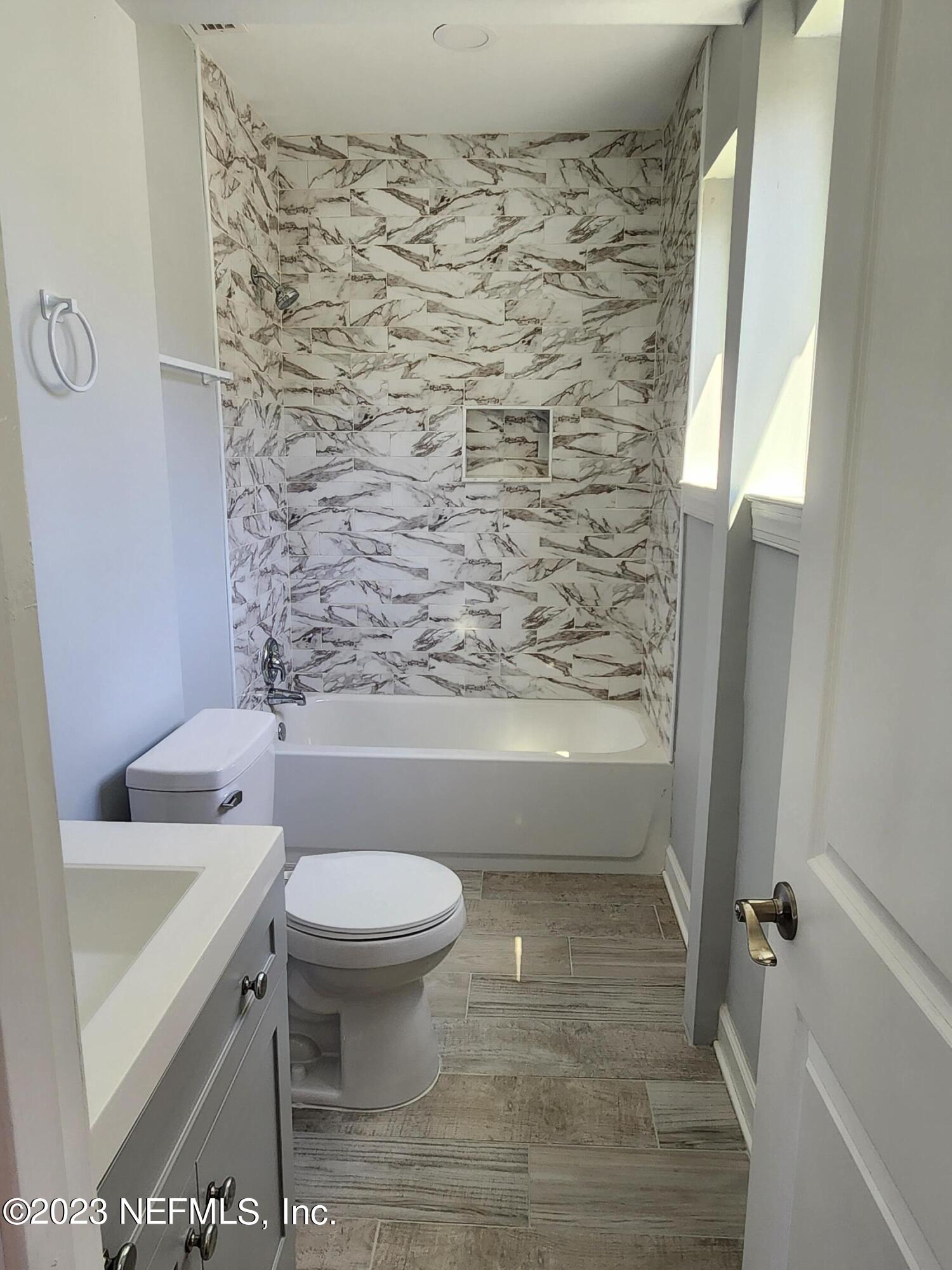 1306 Morgana Road Jacksonville, FL 32211 - Photo 25 of 33 a bathroom with a toilet and a shower