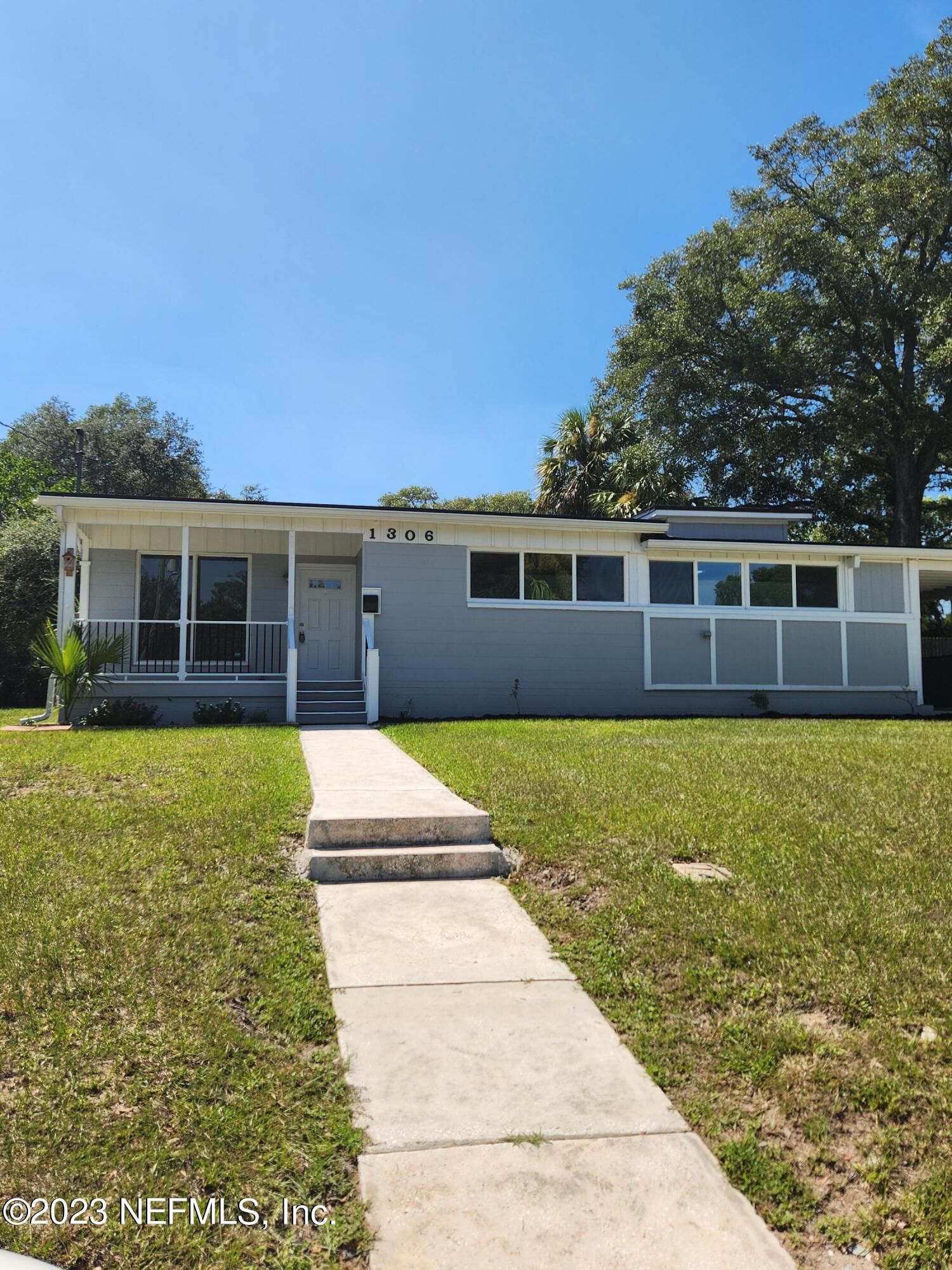1306 Morgana Road Jacksonville, FL 32211 - Photo 4 of 33 a house view with swimming pool and wooden fence