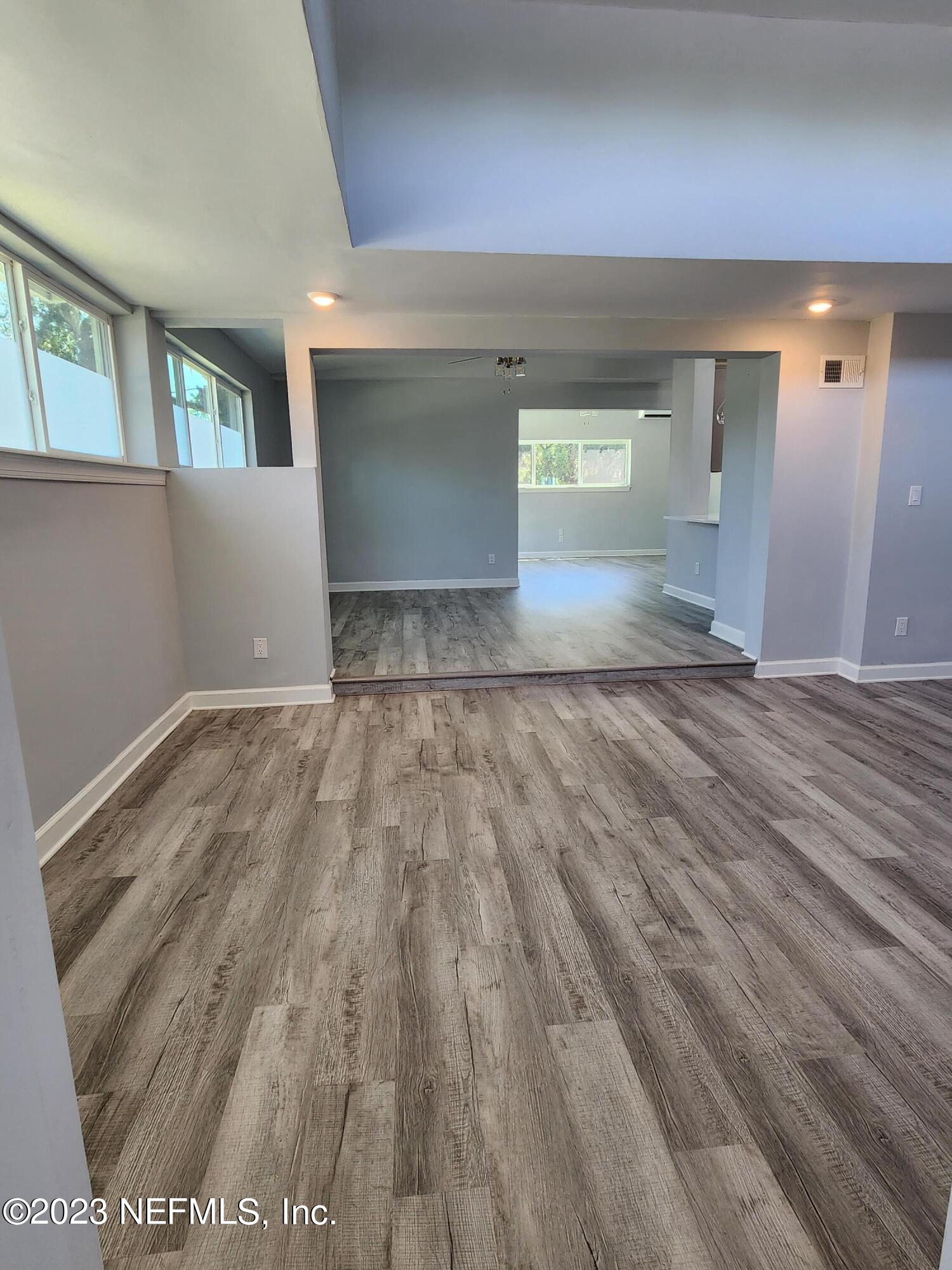 1306 Morgana Road Jacksonville, FL 32211 - Photo 9 of 33 a view of wooden floor and windows in a room