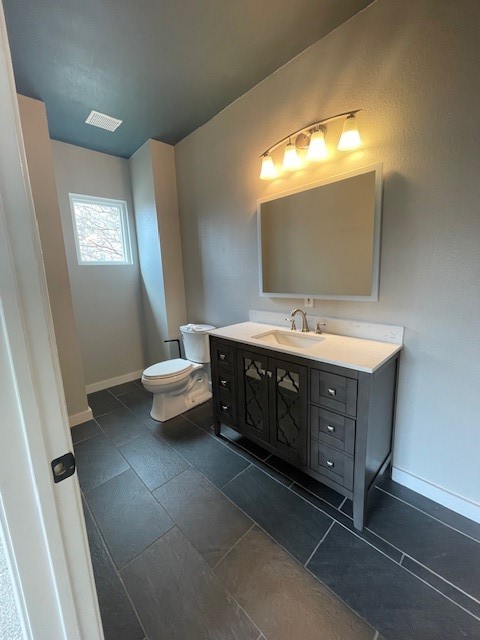 7501 Shadowridge Run, Unit 135 Austin, TX 78749 - Photo 12 of 23 a spacious bathroom with a double vanity sink and a mirror