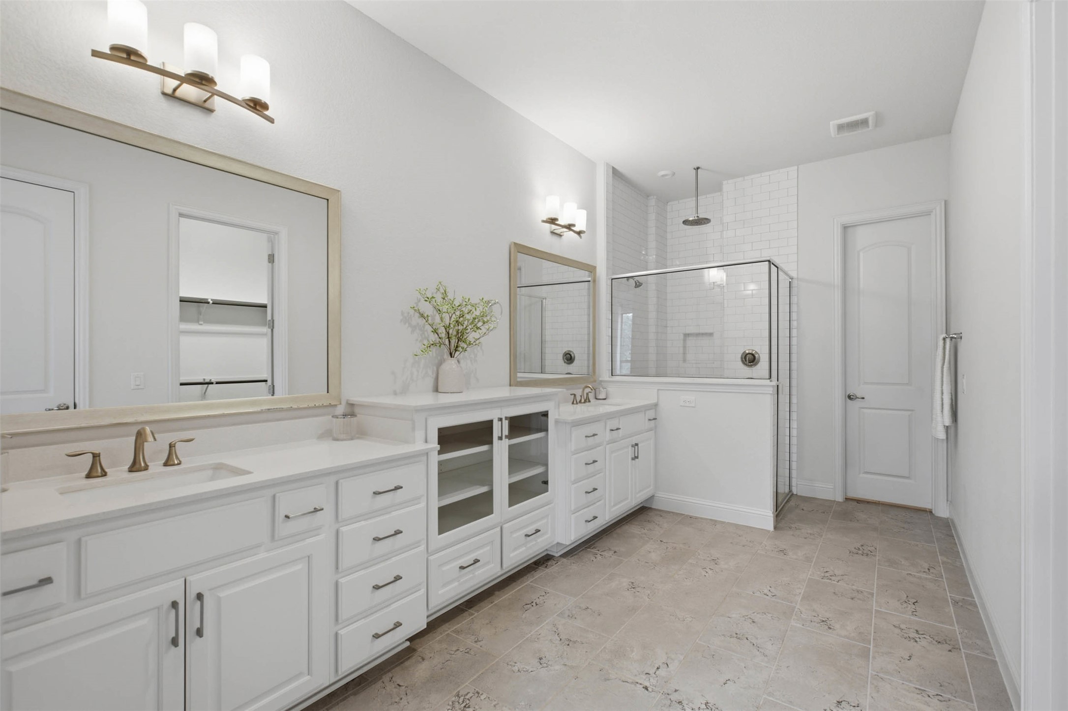 213 Diamondback Drive Georgetown, TX 78628 - Photo 8 of 37 A truly show-stopping spa-inspired primary bath features an oversized walk-in rain shower, an custom dual vanity with glass-front cabinetry, creating a true retreat setting.