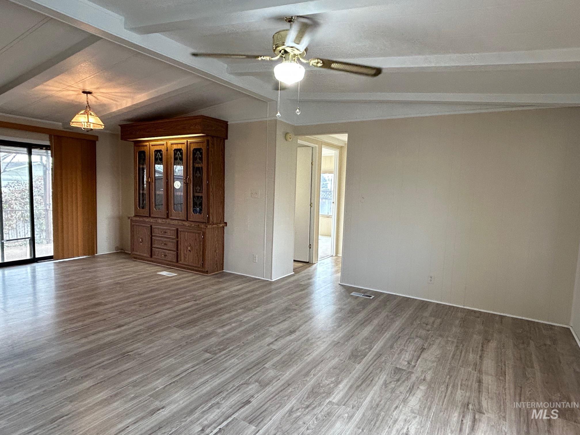 2015 6th Avenue, Unit 131A Clarkston, WA 99403 - Photo 4 of 26 Unfurnished room with wood finished floors and ceiling fan