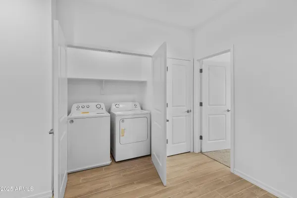 a view of utility room with dryer and washer