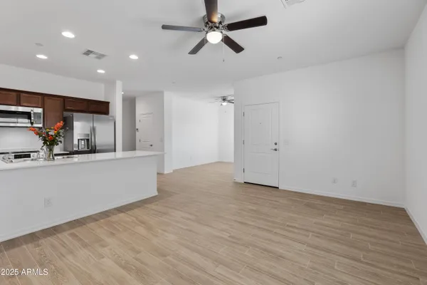 a view of kitchen with wooden floor and window