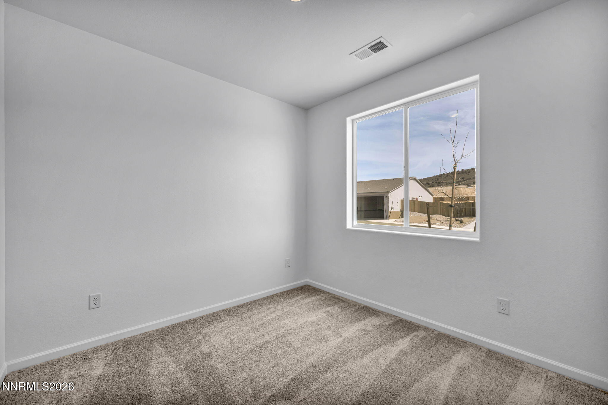 6676 Morgan Mill Road, Unit HOMESITE 14 Carson City, NV 89701 - Photo 11 of 24 an empty room with a window