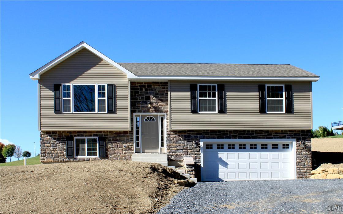 437 English Road Bath, PA 18014 - Photo 1 of 11 a front view of a house with a garage