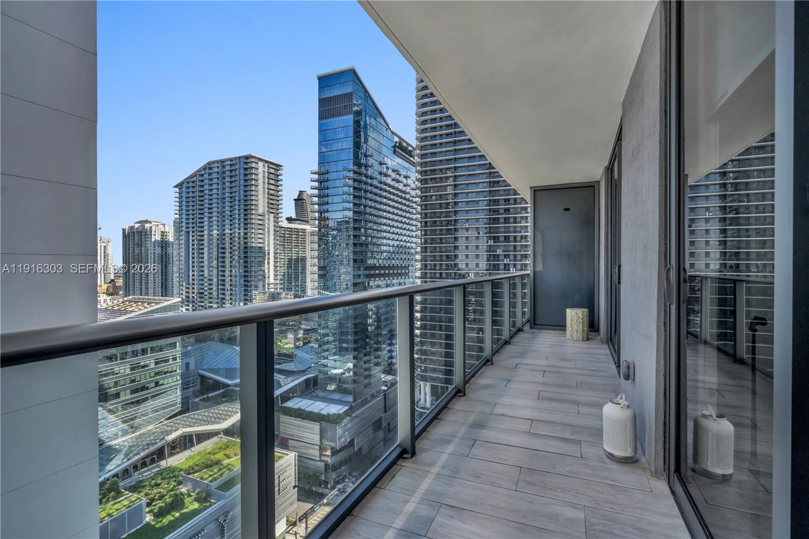55 Southwest 9th Street, Unit 2610 Miami, FL 33130 - Photo 1 of 21 a view of balcony with wooden floor