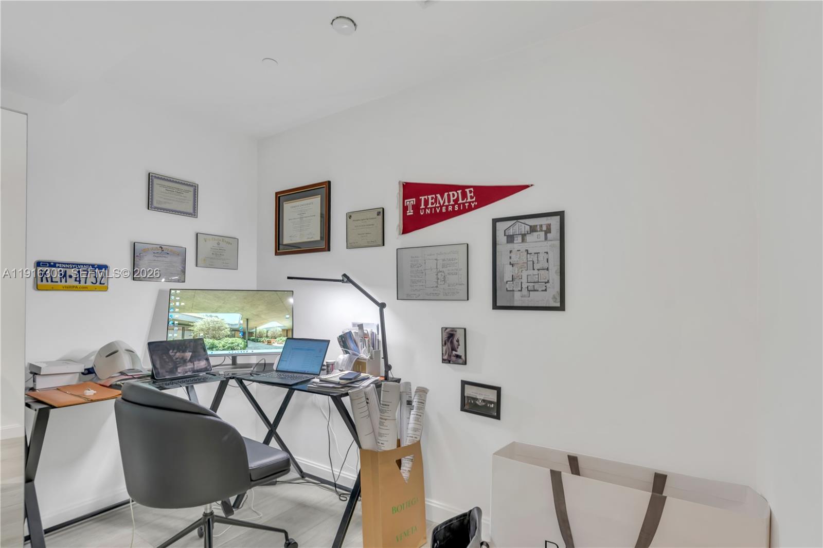 55 Southwest 9th Street, Unit 2610 Miami, FL 33130 - Photo 12 of 21 a workspace with furniture and couch