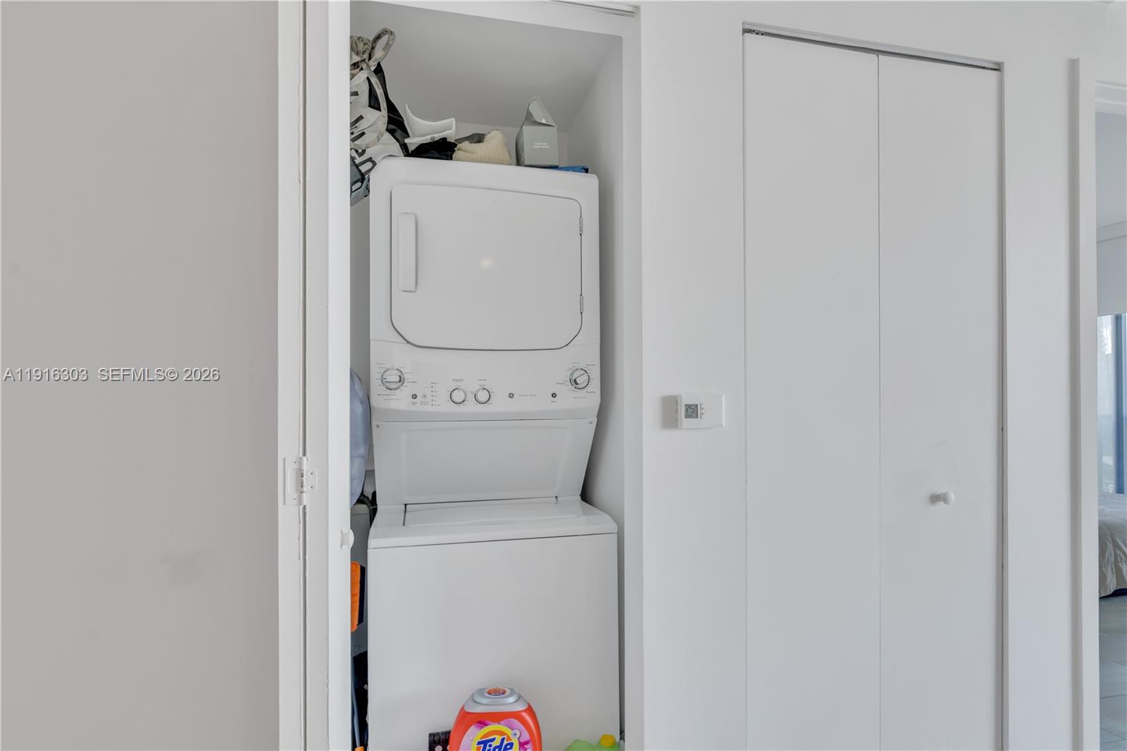 55 Southwest 9th Street, Unit 2610 Miami, FL 33130 - Photo 13 of 21 a utility room with dryer and washer