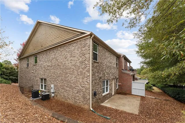 a view of backyard of house with stairs