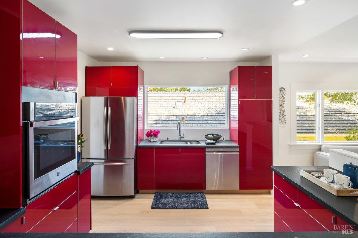 338 Paloma Avenue San Rafael, CA 94901 - Photo 11 of 31 a kitchen with stainless steel appliances kitchen island granite countertop a refrigerator and a stove