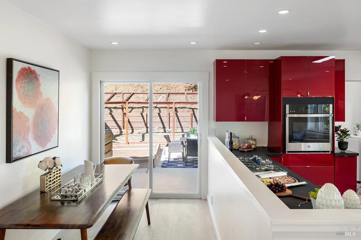 338 Paloma Avenue San Rafael, CA 94901 - Photo 14 of 31 a kitchen with stainless steel appliances kitchen island granite countertop a stove and a refrigerator