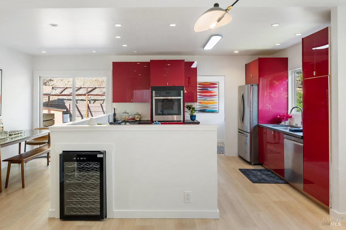 338 Paloma Avenue San Rafael, CA 94901 - Photo 10 of 31 a kitchen with stainless steel appliances kitchen island granite countertop a refrigerator and a stove top oven