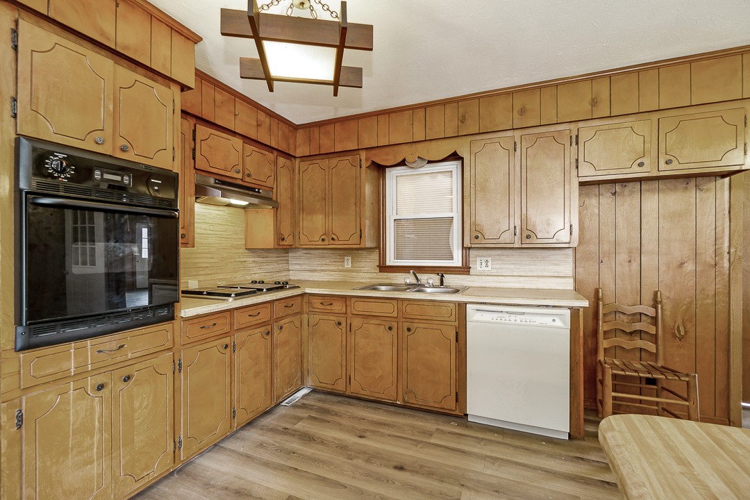 229 County House Road Sparta, TN 38583 - Photo 11 of 33 a kitchen with stainless steel appliances granite countertop a sink and cabinets