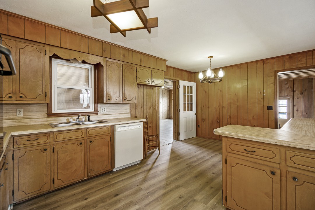 229 County House Road Sparta, TN 38583 - Photo 14 of 33 a kitchen with white cabinets and stainless steel appliances