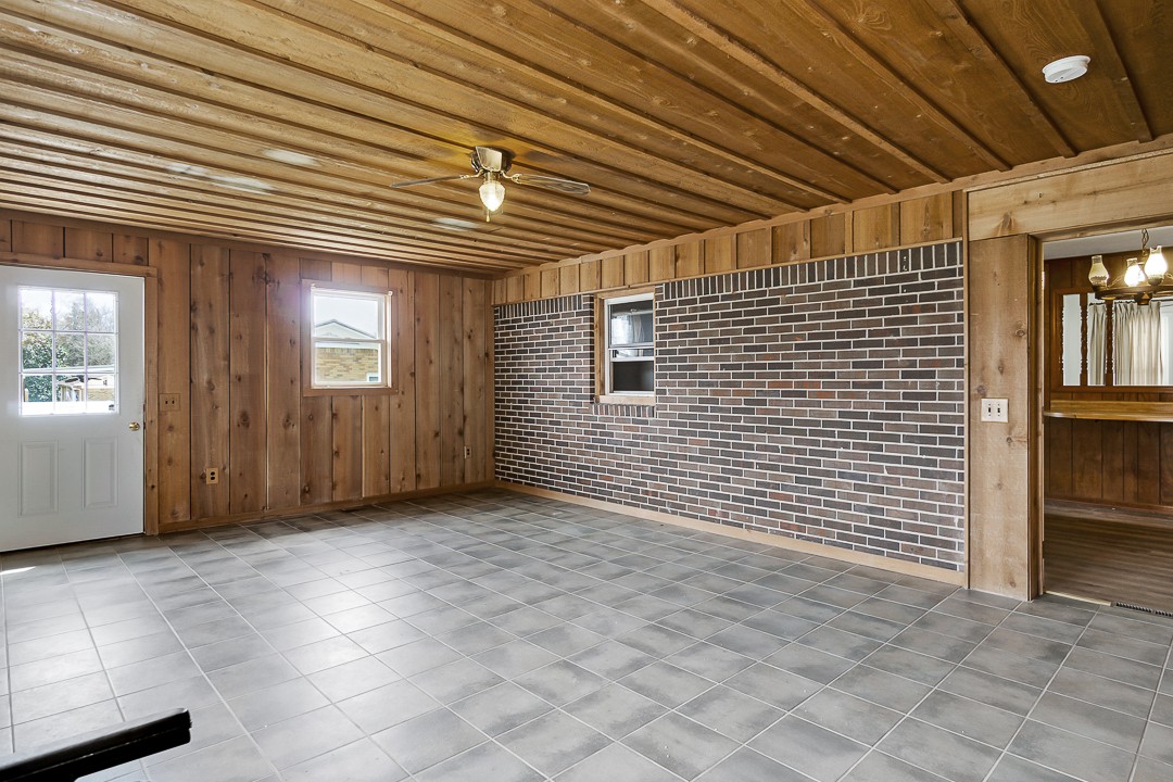 229 County House Road Sparta, TN 38583 - Photo 16 of 33 a view of a porch with a table and chairs and chandelier