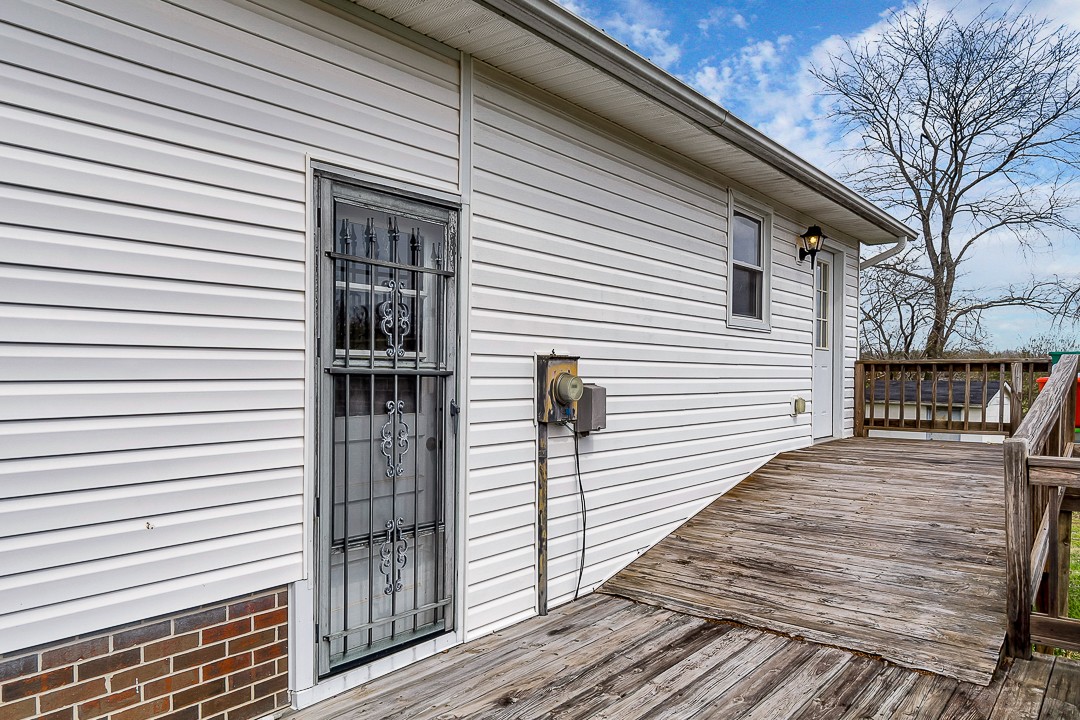 229 County House Road Sparta, TN 38583 - Photo 6 of 33 a view of a balcony with wooden floor and floor to ceiling window