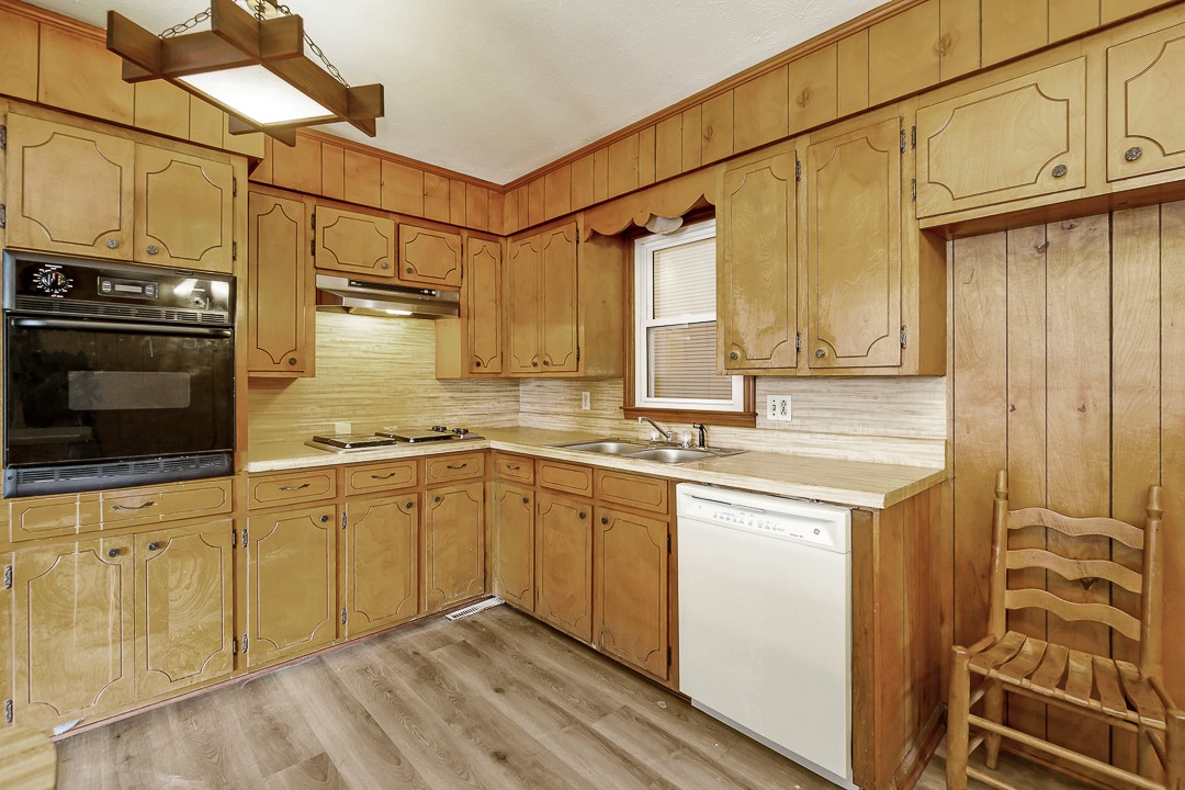 229 County House Road Sparta, TN 38583 - Photo 10 of 33 a kitchen with stainless steel appliances granite countertop a sink and cabinets