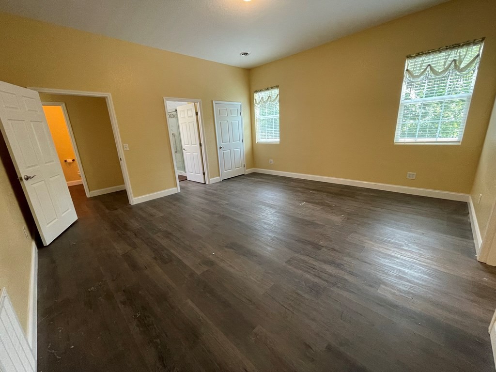 1763 Rays Gap Road Seymour, TN 37865 - Photo 23 of 34 a view of an empty room with wooden floor and a window