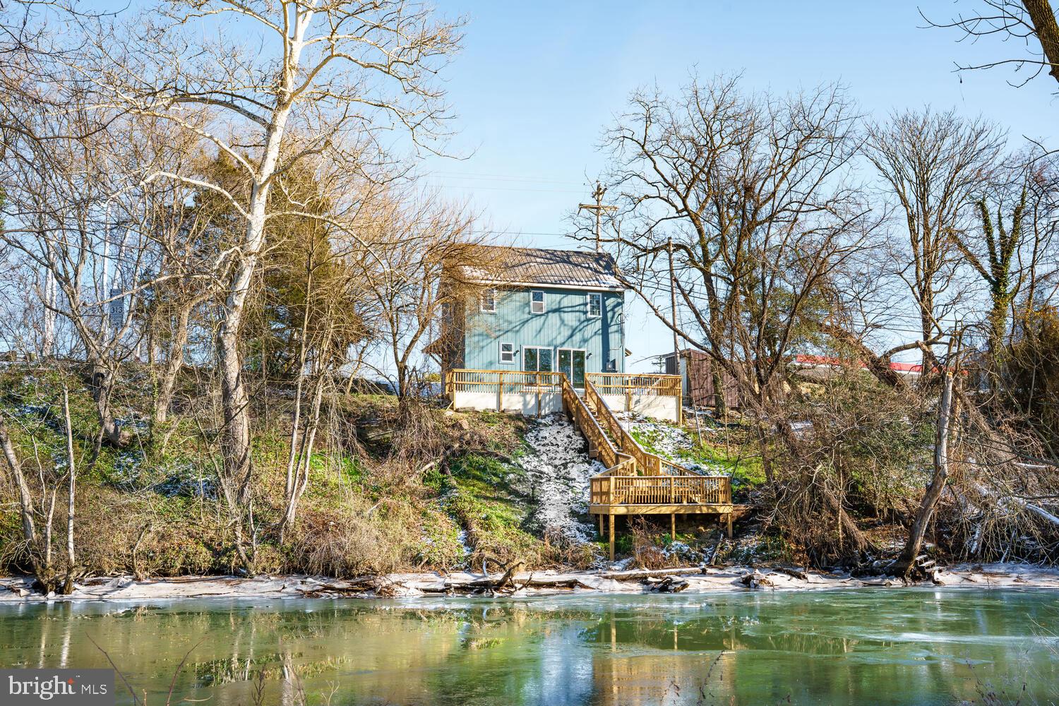 13306 Greensboro Road Greensboro, MD 21639 - Photo 1 of 48 a front view of a house with a lake view