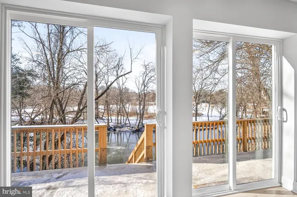 a view of a porch and wooden floor