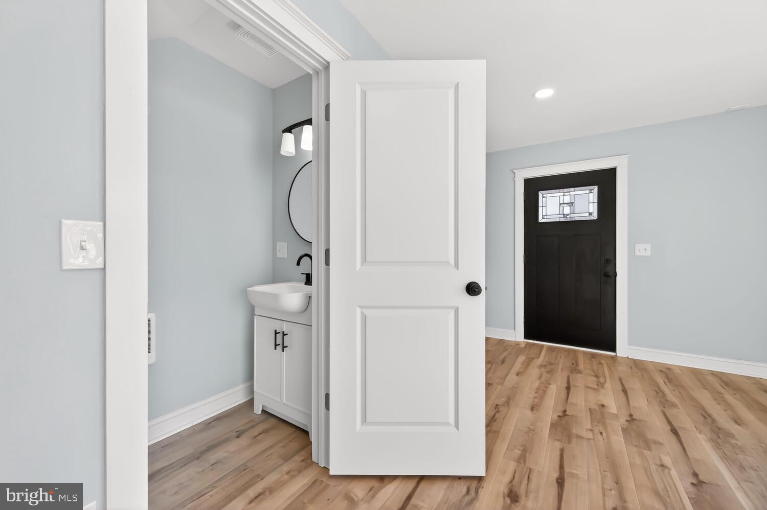 13306 Greensboro Road Greensboro, MD 21639 - Photo 15 of 48 a view of a hallway with closet and wooden floor