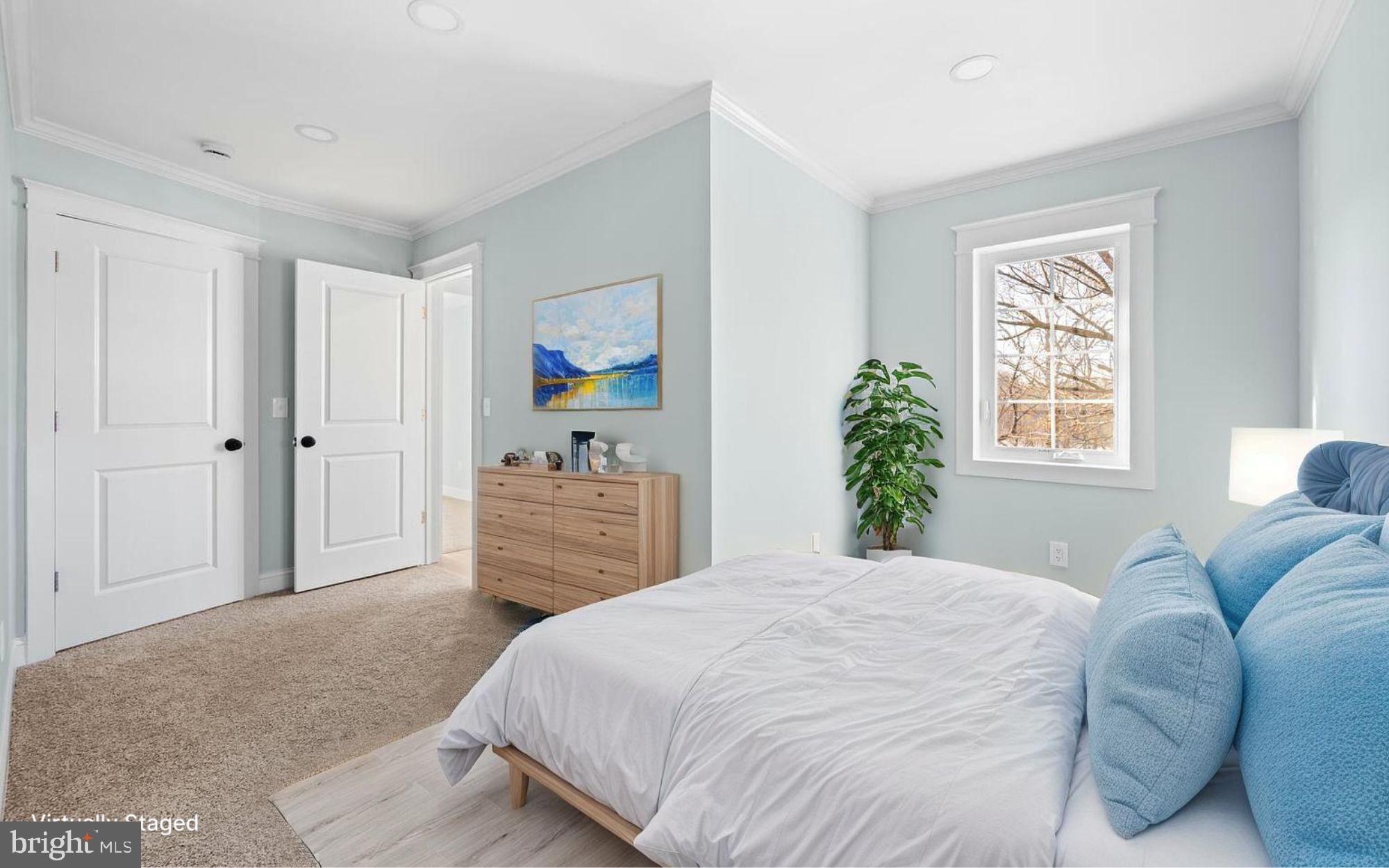 13306 Greensboro Road Greensboro, MD 21639 - Photo 19 of 48 a bedroom with a bed and a dresser with the potted plant