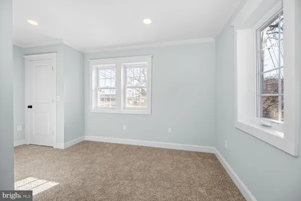 a big room with windows and closet