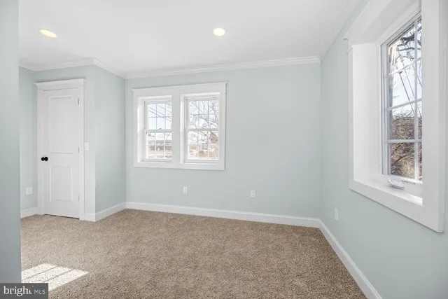 a big room with windows and closet