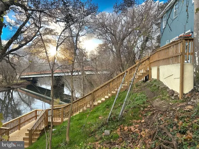 a view of wooden balcony with outdoor seating