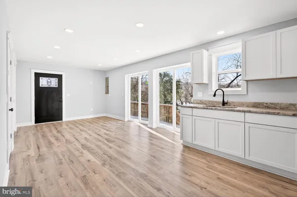 a bedroom with a large bed and a large window