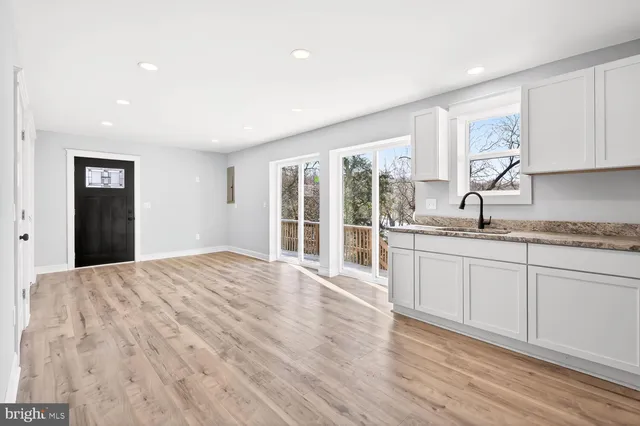 a bedroom with a large bed and a large window